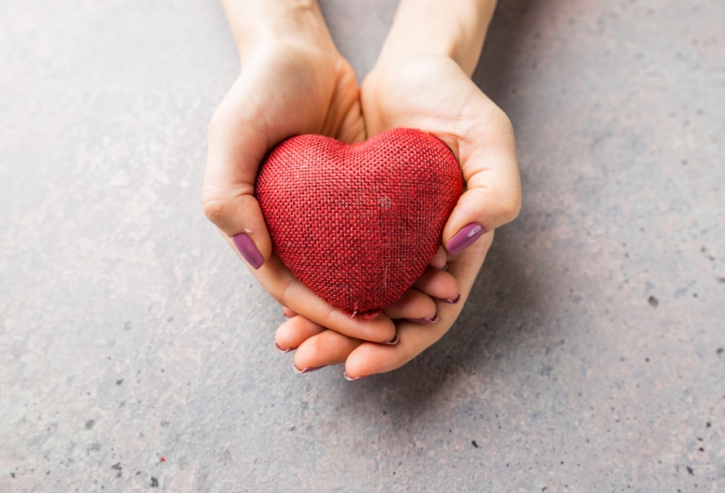 female-hands-giving-red-heart-2021-09-01-11-25-46-utc